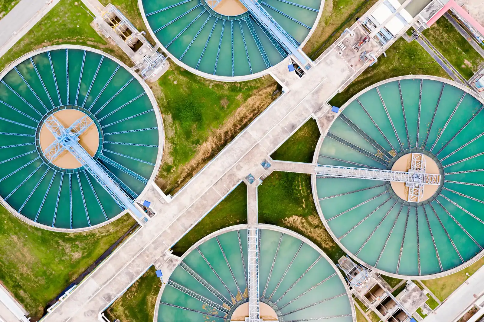 Aerial view of circular clarifier tanks at a wastewater treatment plant